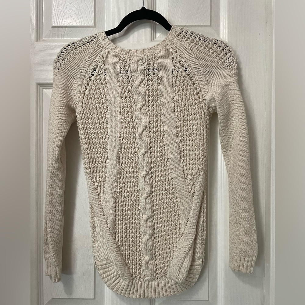 Knitted sweater with gold accents